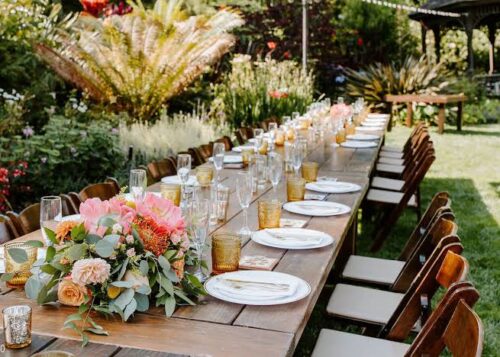 Botanical garden wedding ceremony surrounded by flowers and greenery