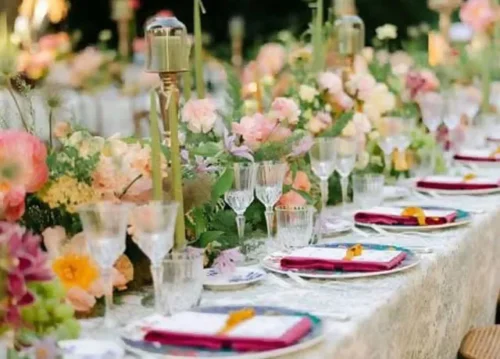 Lush botanical garden wedding ceremony with flowers, greenery, and garden fountain