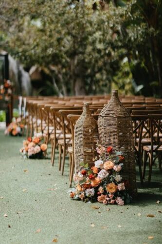 Rustic garden wedding ceremony with manicured lawn, greenery, and outdoor seating